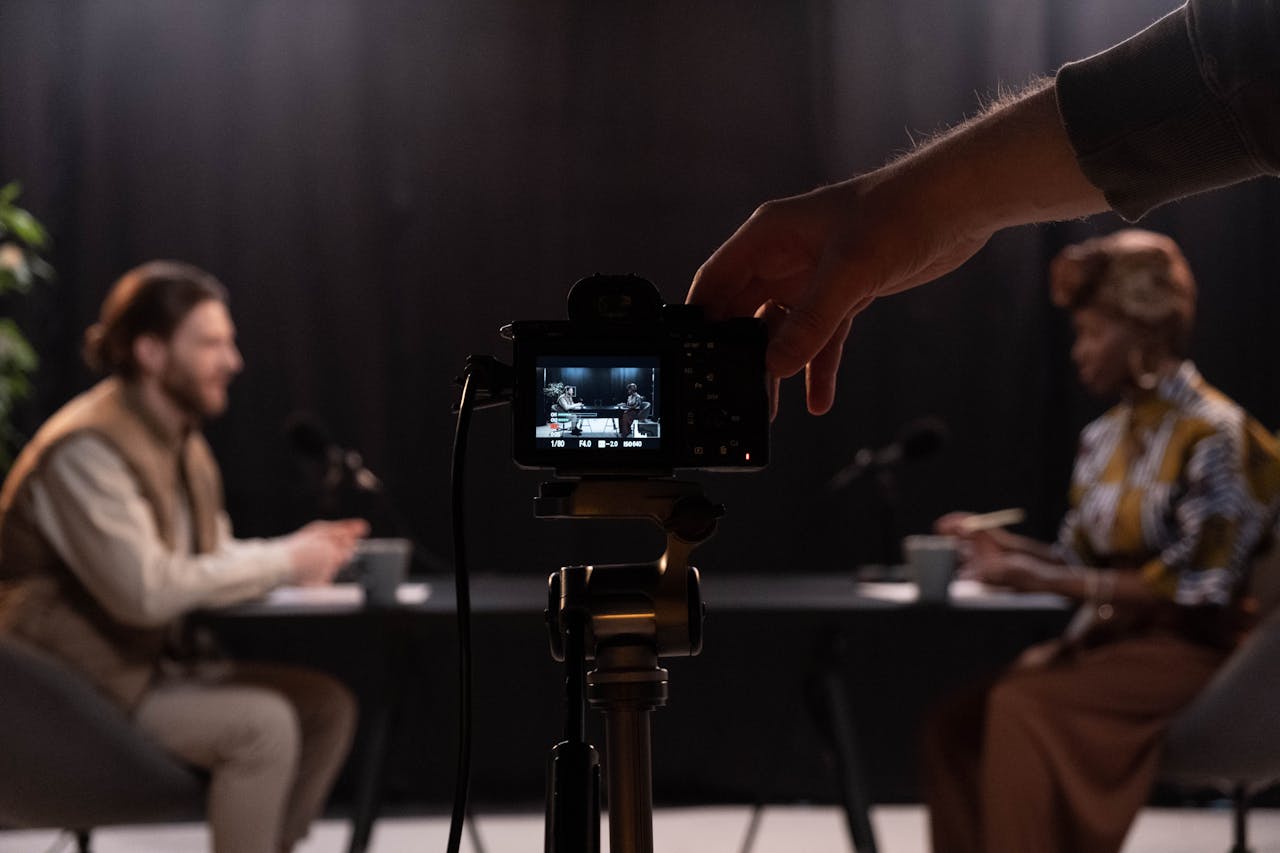 Professional podcast session recording with diverse hosts in studio.